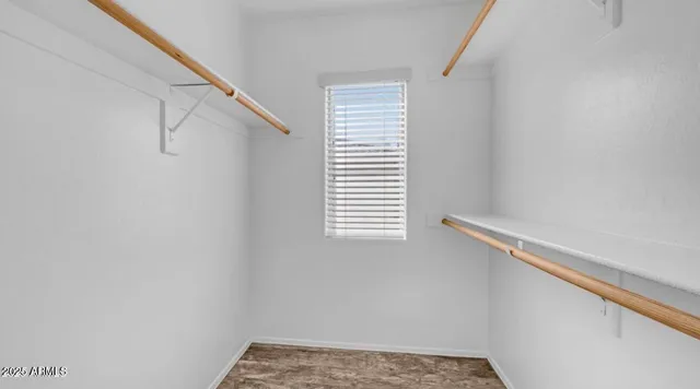 a view of a small space with window and a white wall