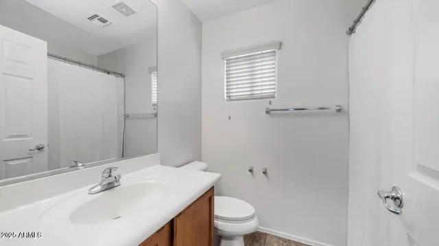 a bathroom with a sink toilet and vanity