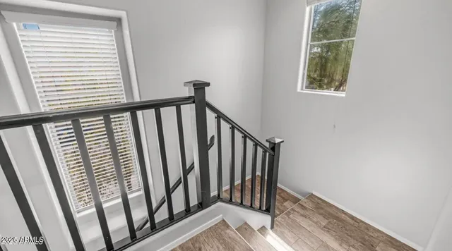 a view of a balcony with wooden floor