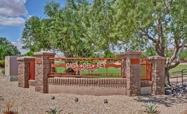 a view of street with wooden fence
