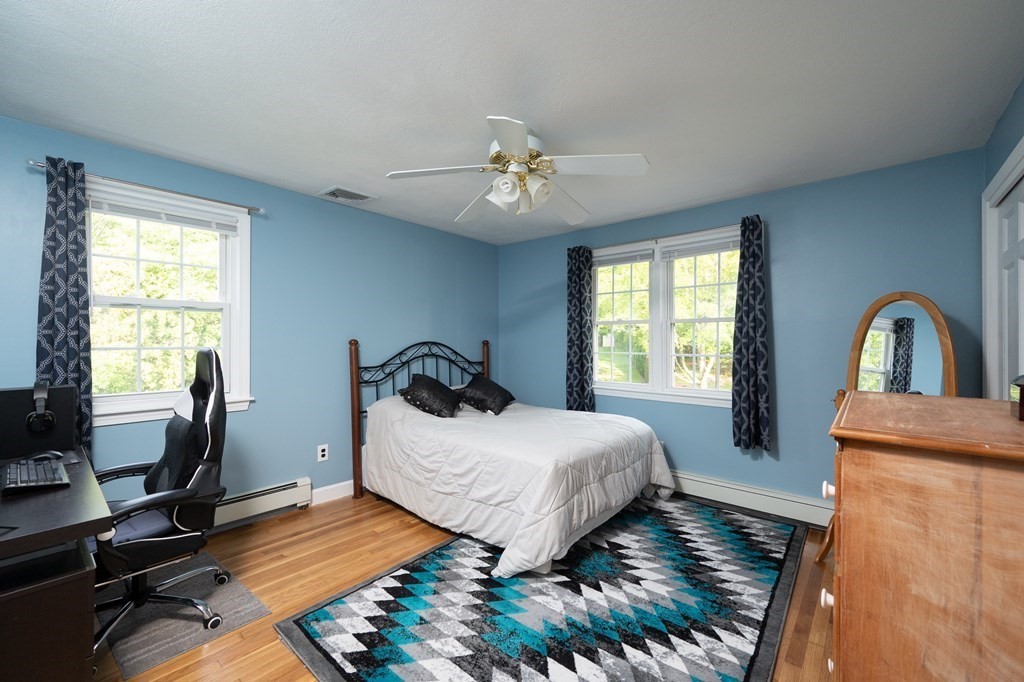 21 Harvest Lane Hingham, MA 02043 - Photo 20 of 35 a bedroom with a bed and a window