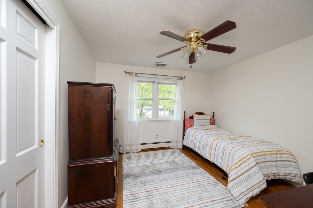 21 Harvest Lane Hingham, MA 02043 - Photo 21 of 35 a bedroom with a bed and a window