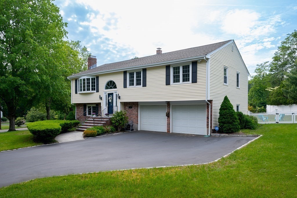 21 Harvest Lane Hingham, MA 02043 - Photo 3 of 35 a front view of a house with a yard and garage