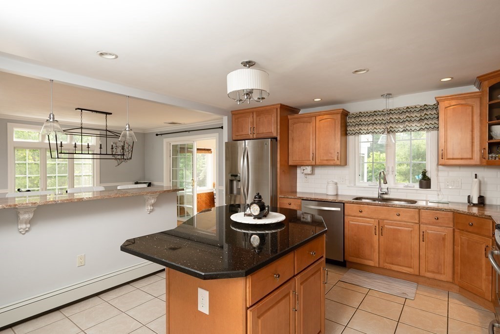 21 Harvest Lane Hingham, MA 02043 - Photo 7 of 35 a kitchen with granite countertop a sink stainless steel appliances and cabinets