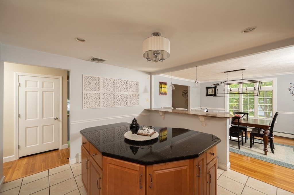 21 Harvest Lane Hingham, MA 02043 - Photo 8 of 35 a kitchen with a table and chairs