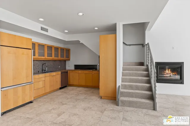 a kitchen with stainless steel appliances refrigerator and cabinets