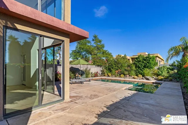 a backyard of a house with seating space