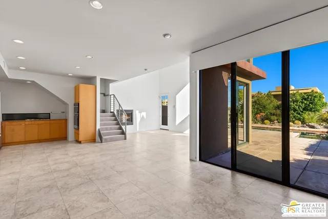 a view of a hall with an entryway