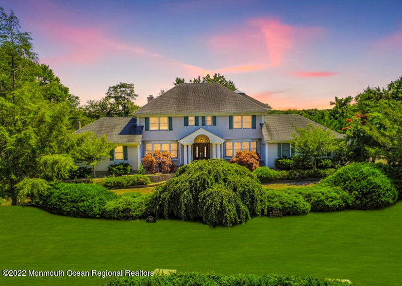 1903 Shadowbrook Drive Wall, NJ 07719 - Photo 2 of 74 a front view of a house with a garden
