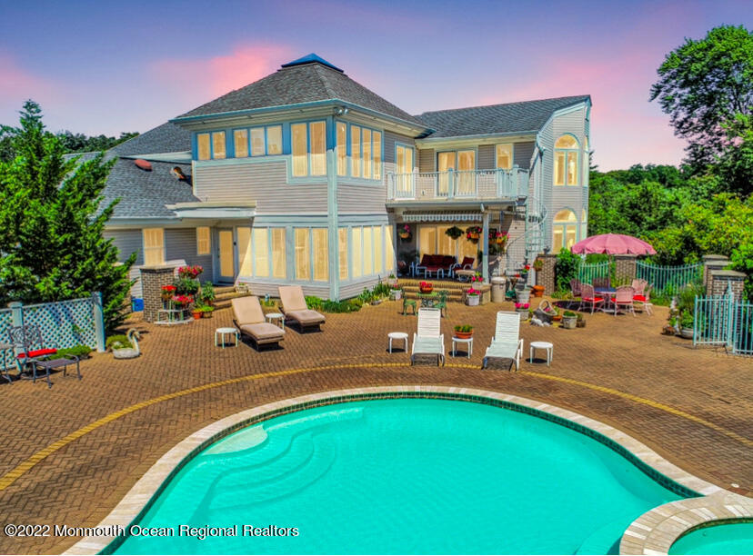 1903 Shadowbrook Drive Wall, NJ 07719 - Photo 3 of 74 a front view of a house with sitting area