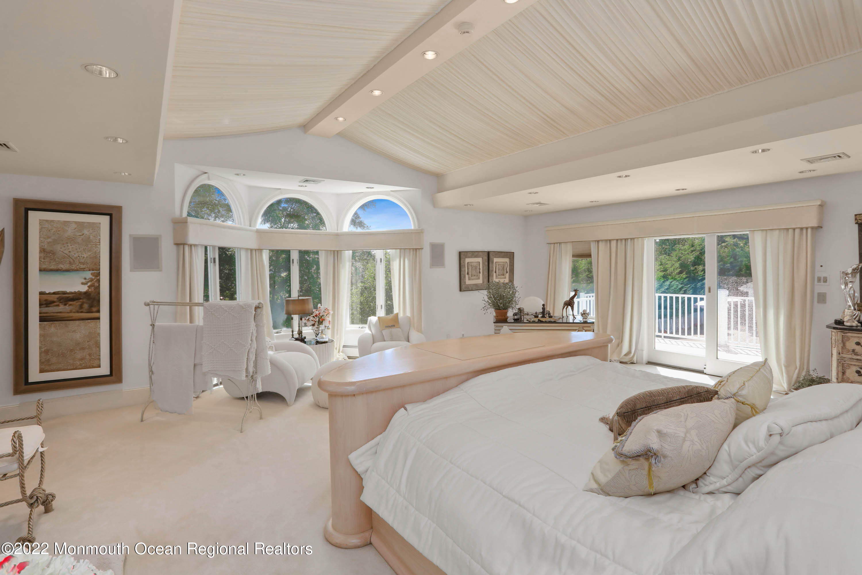 1903 Shadowbrook Drive Wall, NJ 07719 - Photo 31 of 74 a spacious bedroom with a large bed and a large window