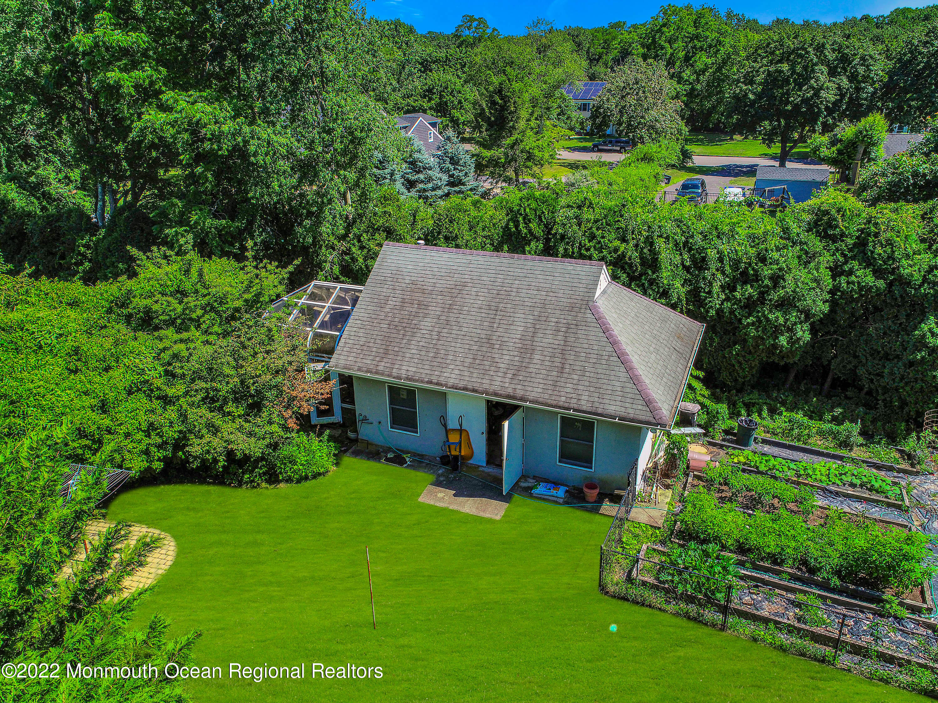 1903 Shadowbrook Drive Wall, NJ 07719 - Photo 53 of 74 an aerial view of a house with a yard table and chairs