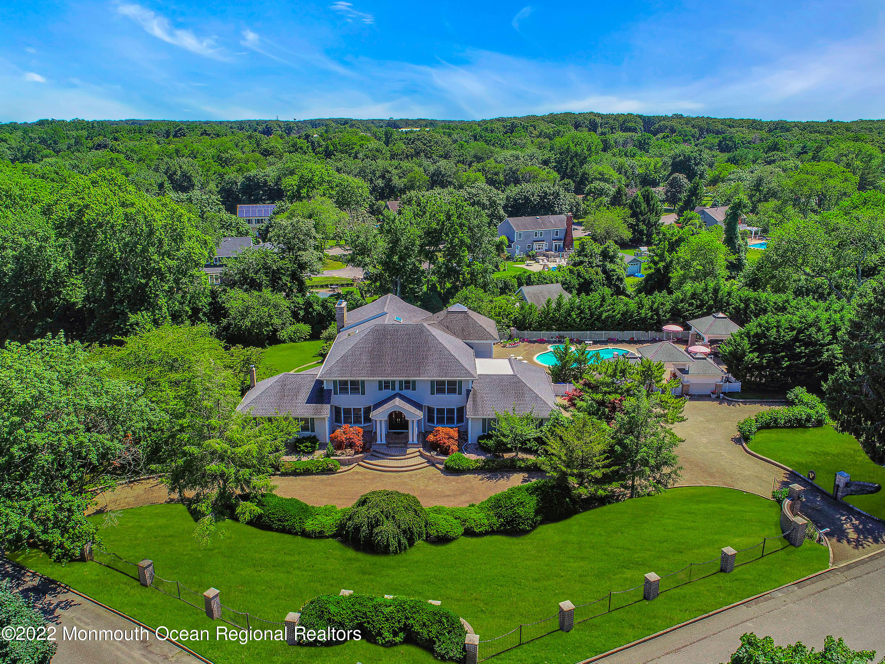 1903 Shadowbrook Drive Wall, NJ 07719 - Photo 67 of 74 a view of a garden with a swimming pool and outdoor seating