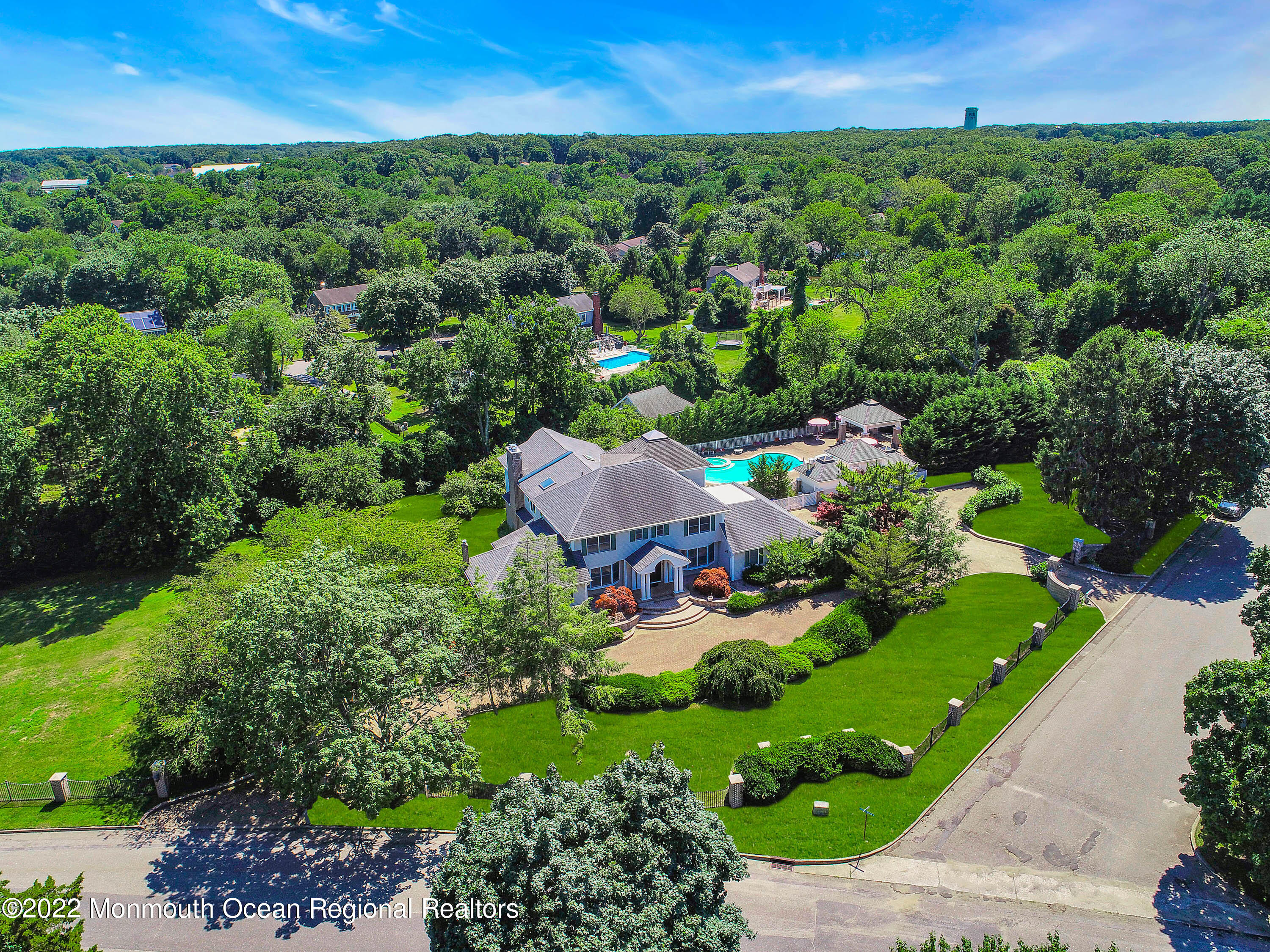 1903 Shadowbrook Drive Wall, NJ 07719 - Photo 68 of 74 a view of a garden with a building in the background