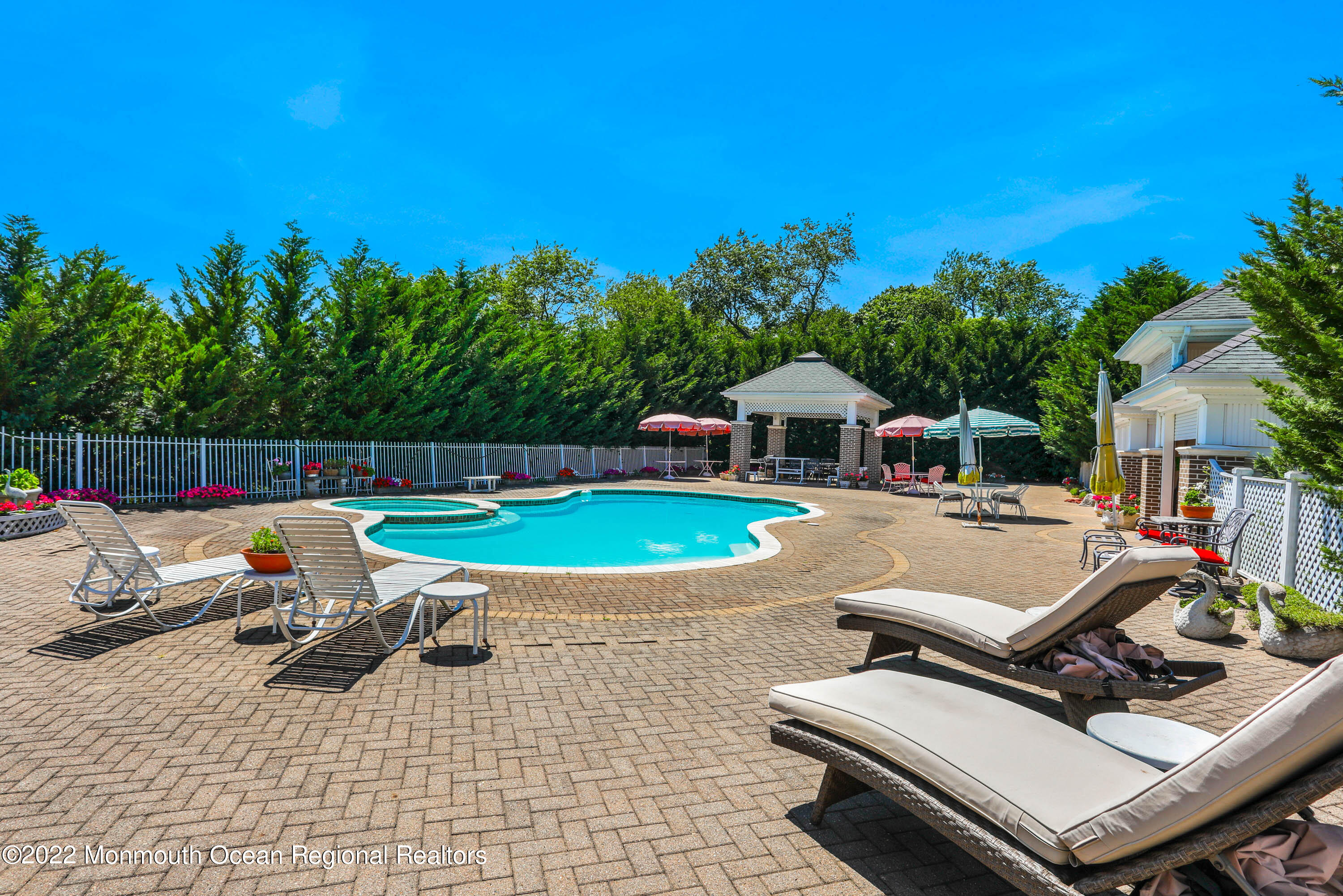 1903 Shadowbrook Drive Wall, NJ 07719 - Photo 69 of 74 a view of a swimming pool with lounge chairs