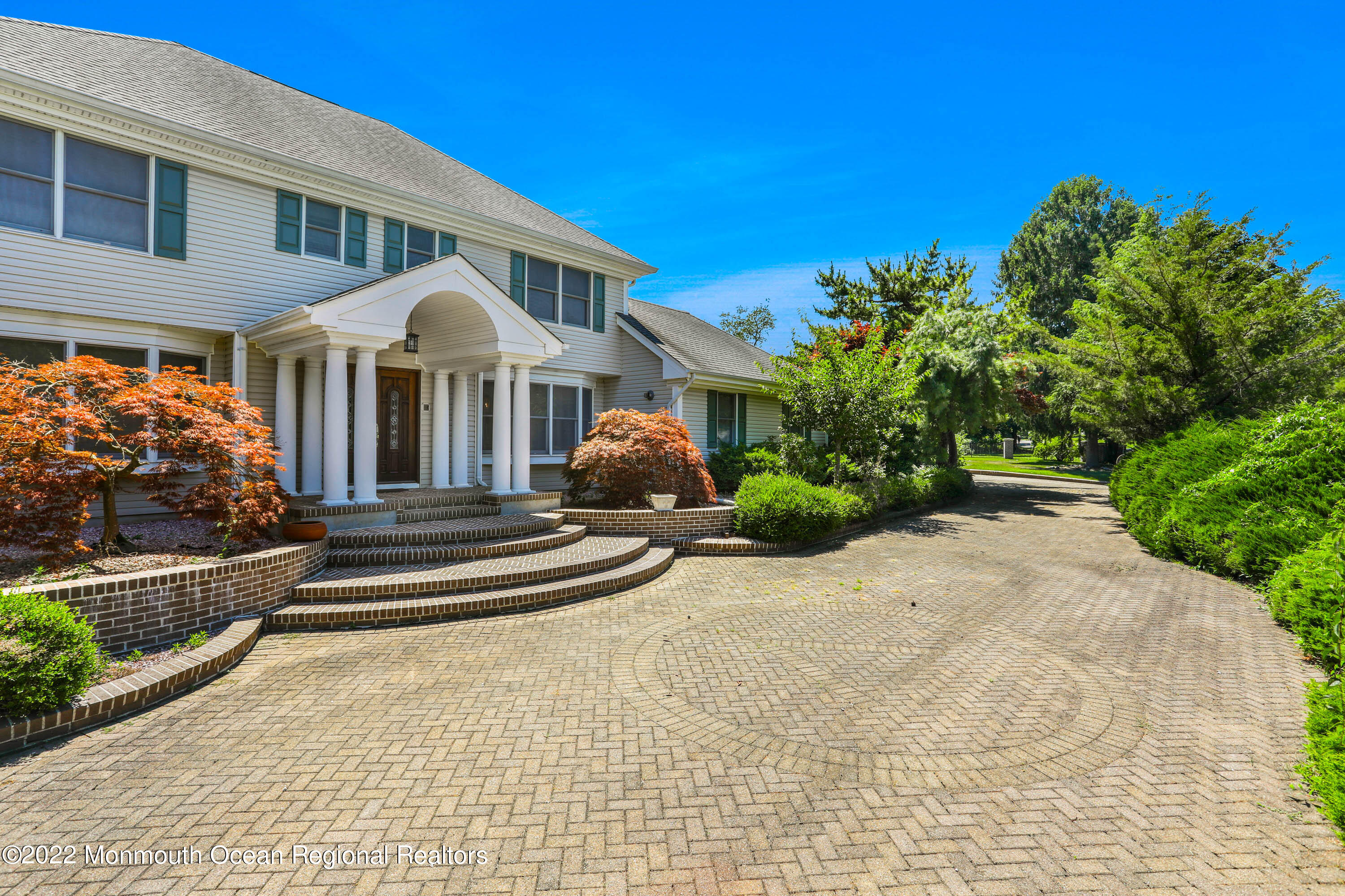 1903 Shadowbrook Drive Wall, NJ 07719 - Photo 72 of 74 a front view of a house with a yard