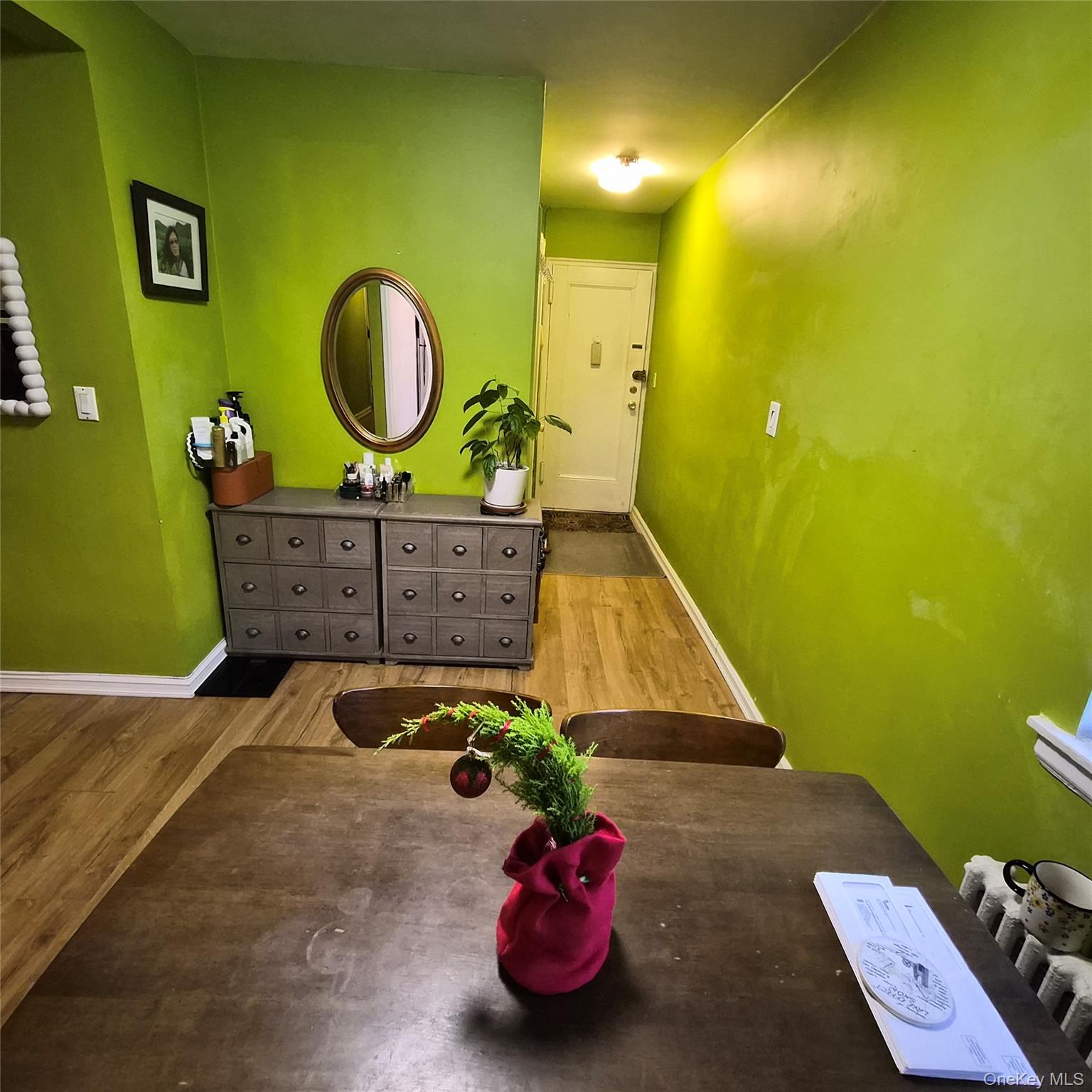 215-09 47th Avenue, Unit 2C Queens, NY 11361 - Photo 9 of 10 a room with toys and a wooden floor