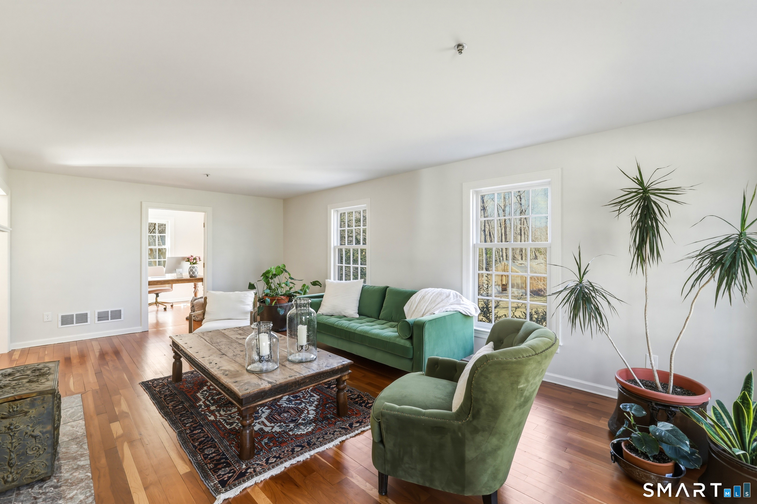 776 Bethany Mountain Road Cheshire, CT 06410 - Photo 15 of 40 a living room with furniture potted plant and a window