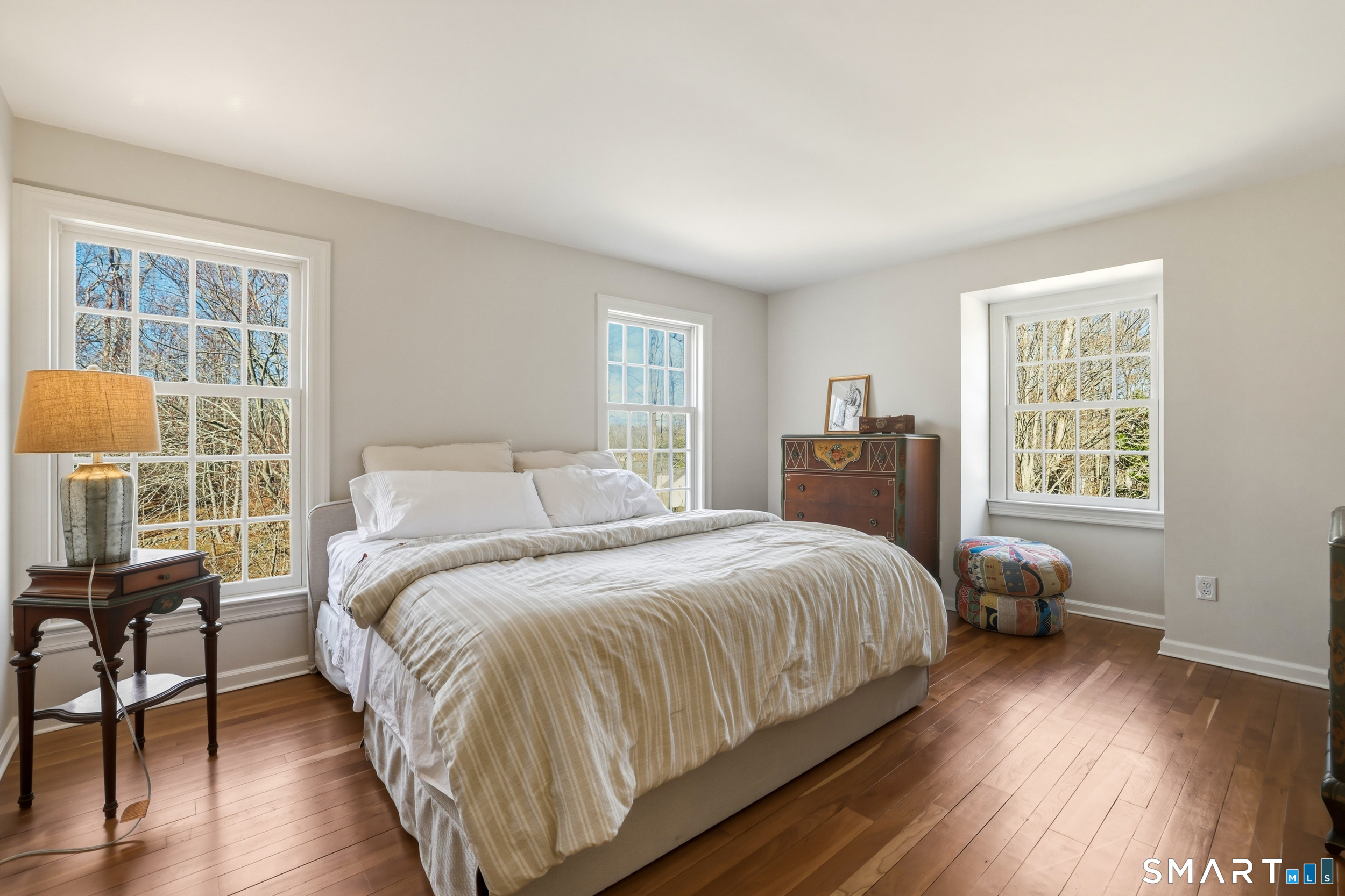 776 Bethany Mountain Road Cheshire, CT 06410 - Photo 18 of 40 a bedroom with a bed and wooden floor