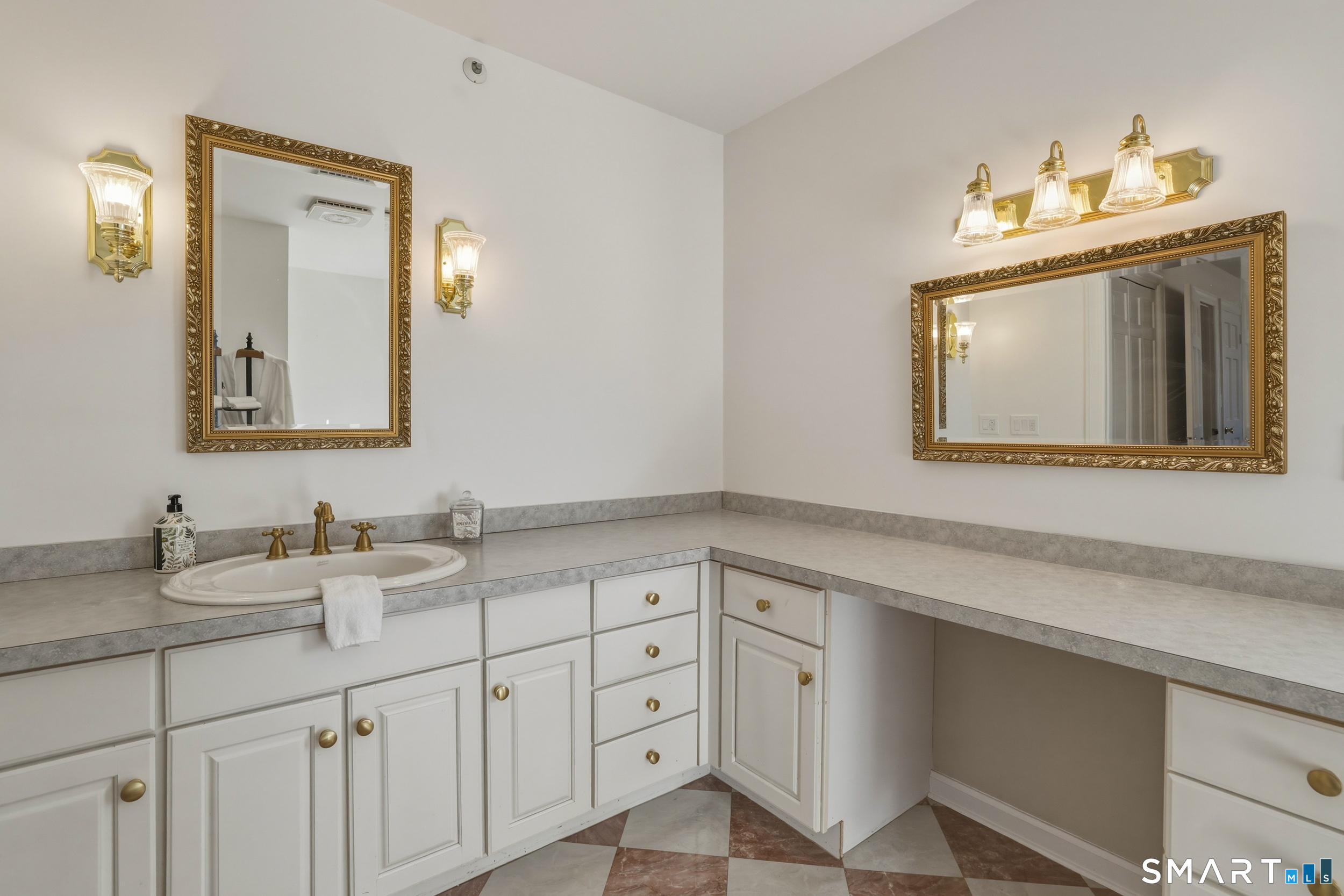 776 Bethany Mountain Road Cheshire, CT 06410 - Photo 20 of 40 a bathroom with double sink and a mirror