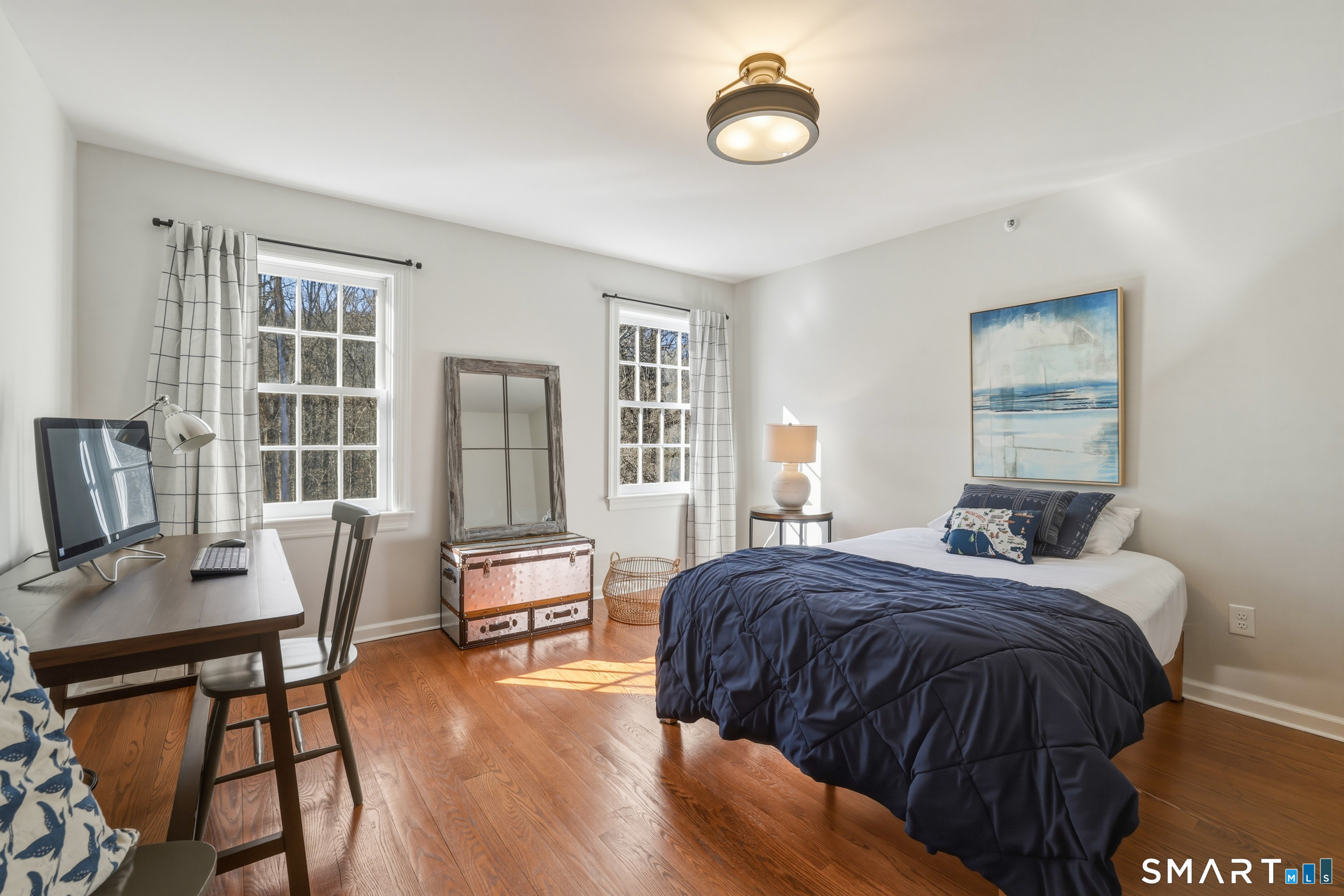 776 Bethany Mountain Road Cheshire, CT 06410 - Photo 22 of 40 a bedroom with a bed and wooden floor