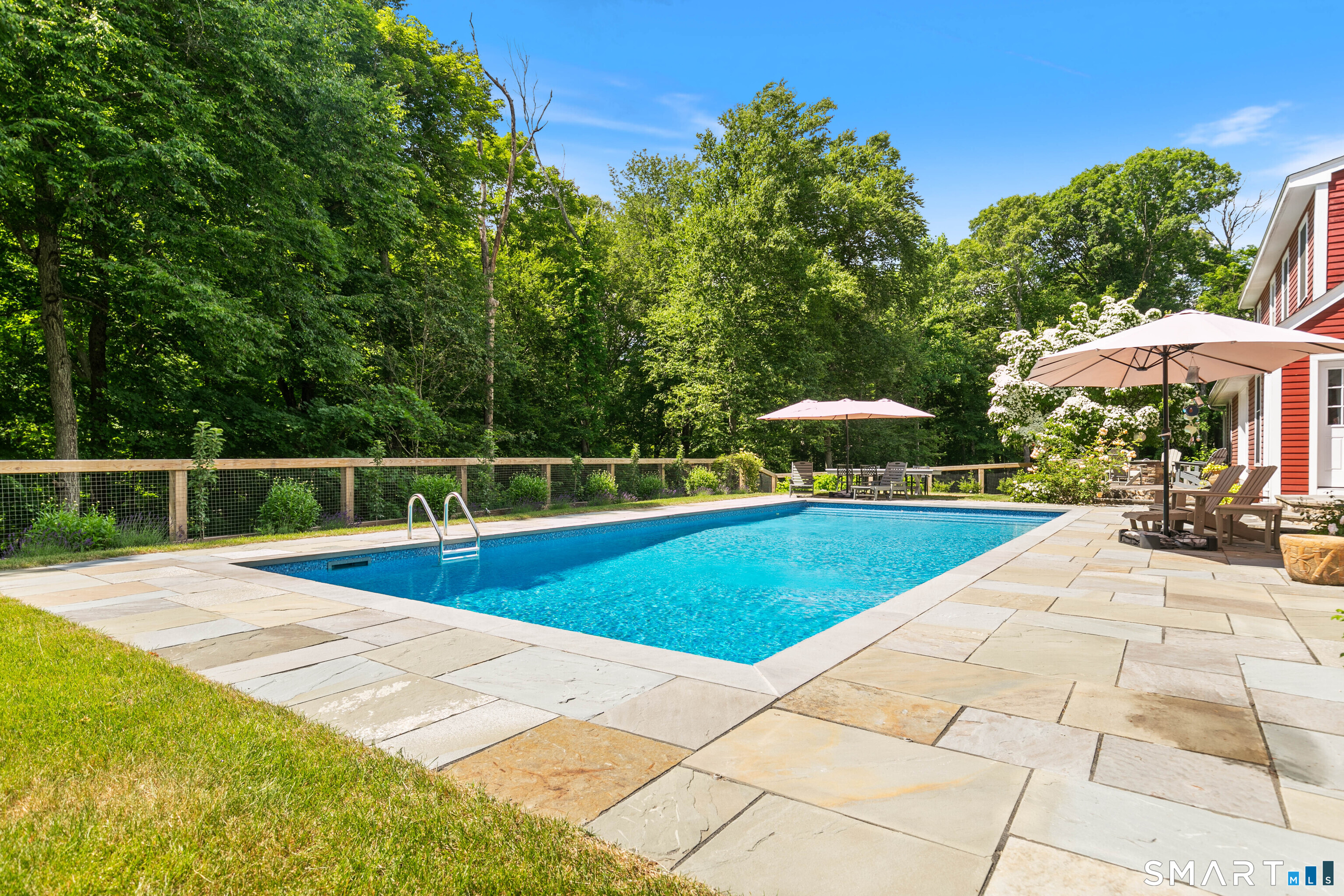 776 Bethany Mountain Road Cheshire, CT 06410 - Photo 29 of 40 a view of a swimming pool with a bench and trees
