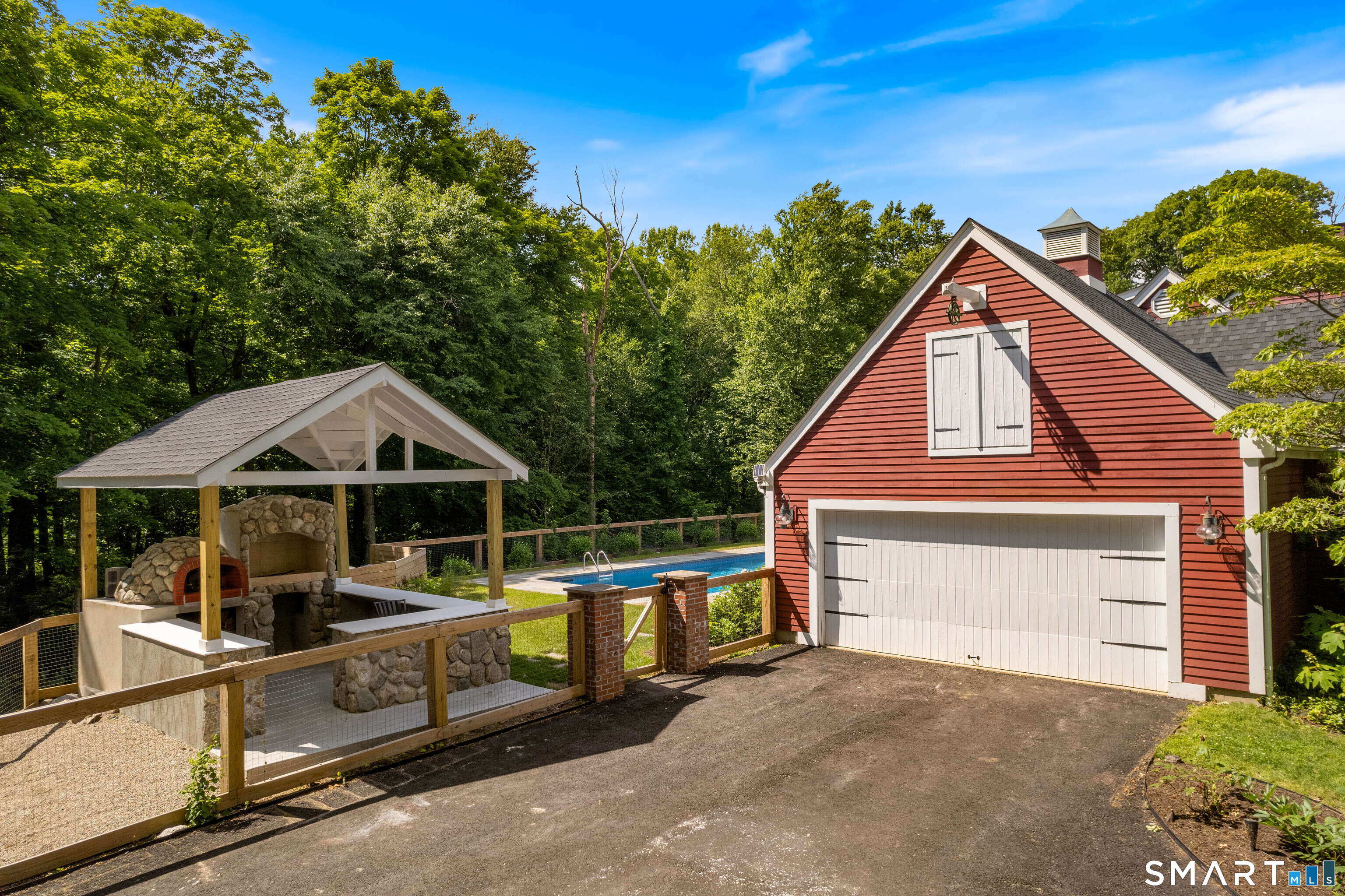 776 Bethany Mountain Road Cheshire, CT 06410 - Photo 31 of 40 a view of a house with wooden deck and furniture