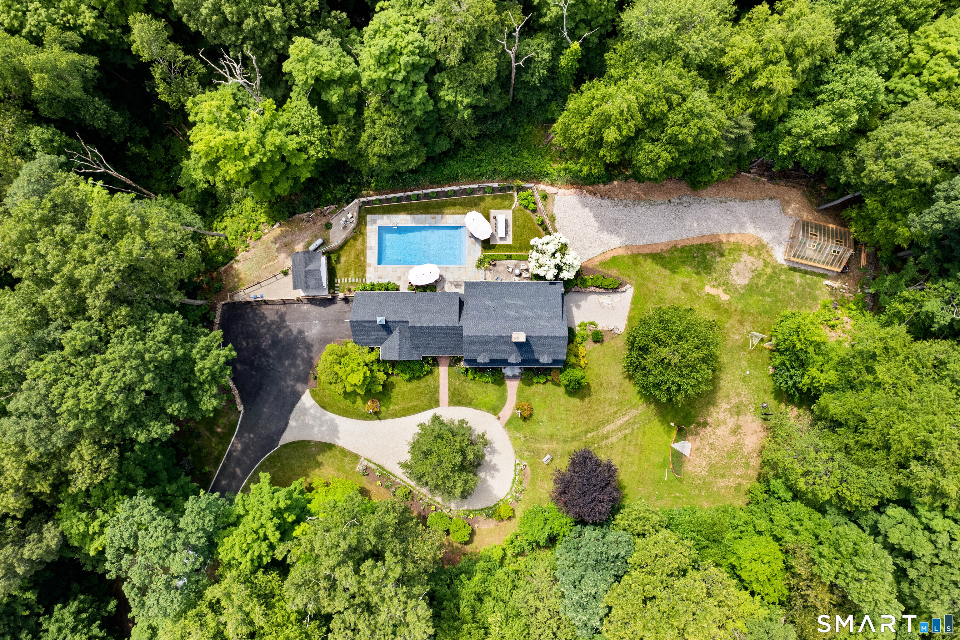 776 Bethany Mountain Road Cheshire, CT 06410 - Photo 32 of 40 an aerial view of a house with a swimming pool