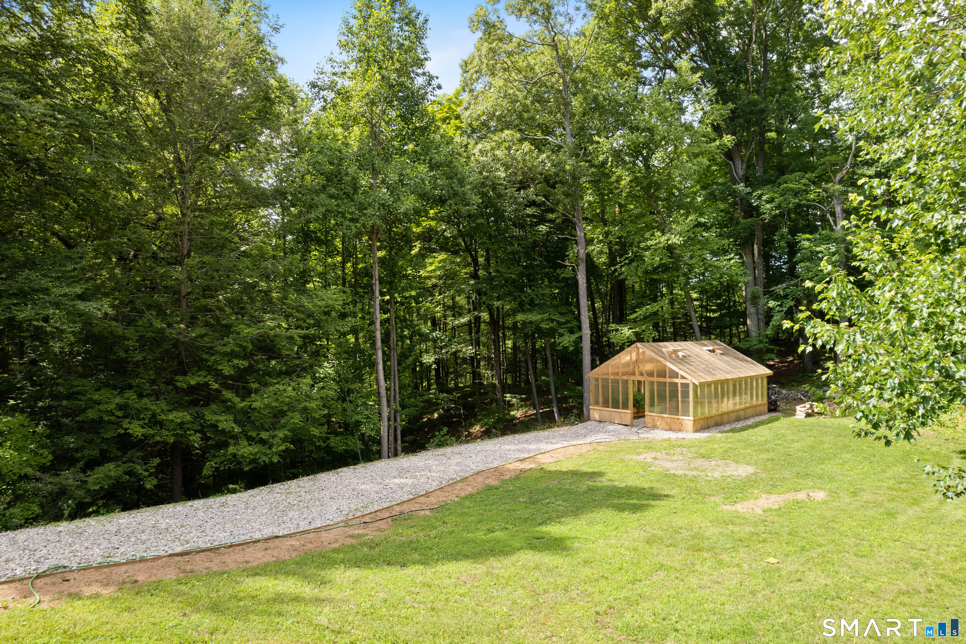 776 Bethany Mountain Road Cheshire, CT 06410 - Photo 33 of 40 a view of a house with a yard
