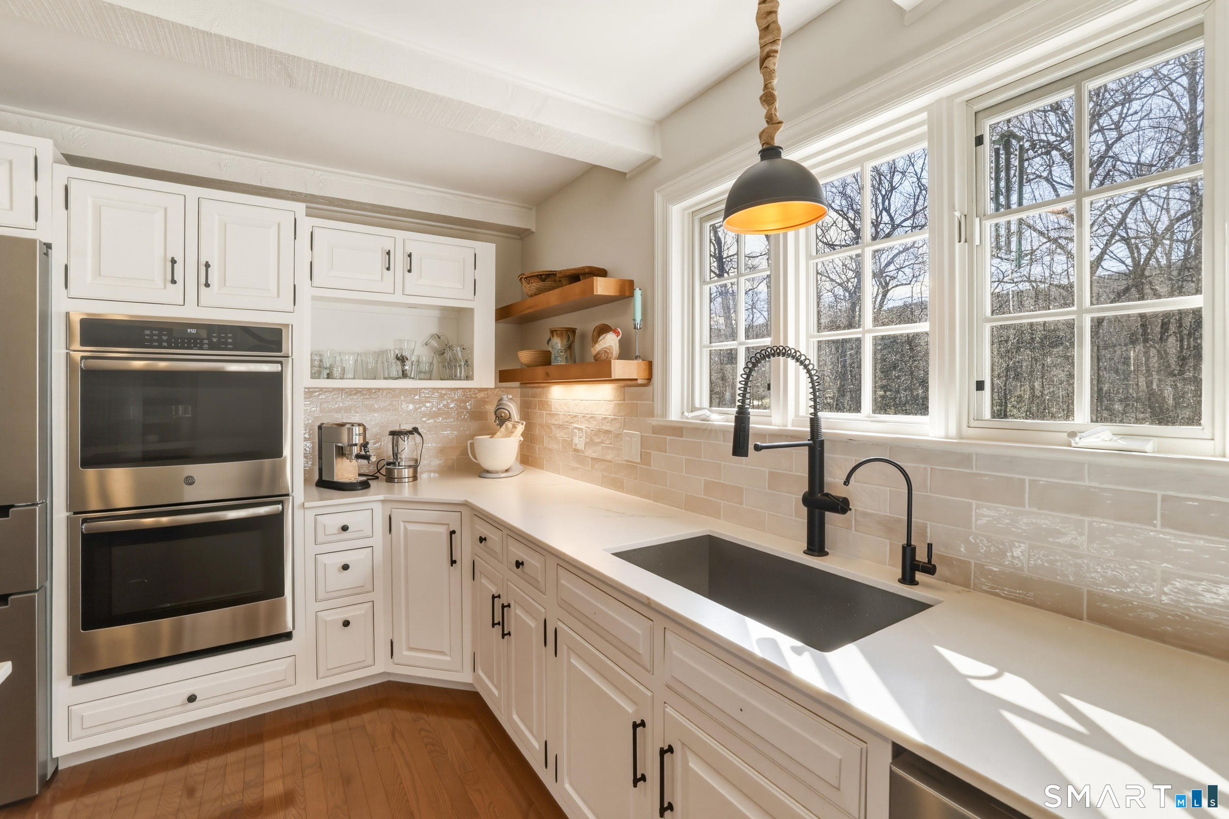 776 Bethany Mountain Road Cheshire, CT 06410 - Photo 9 of 40 a kitchen with a sink and a stove top oven