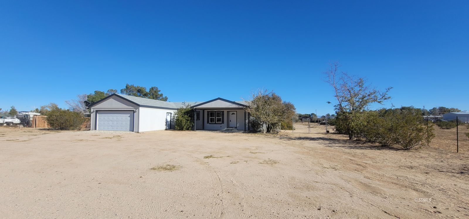1056 North Alford Street Ridgecrest, CA 93555 - Photo 2 of 24 a view of a house with a yard