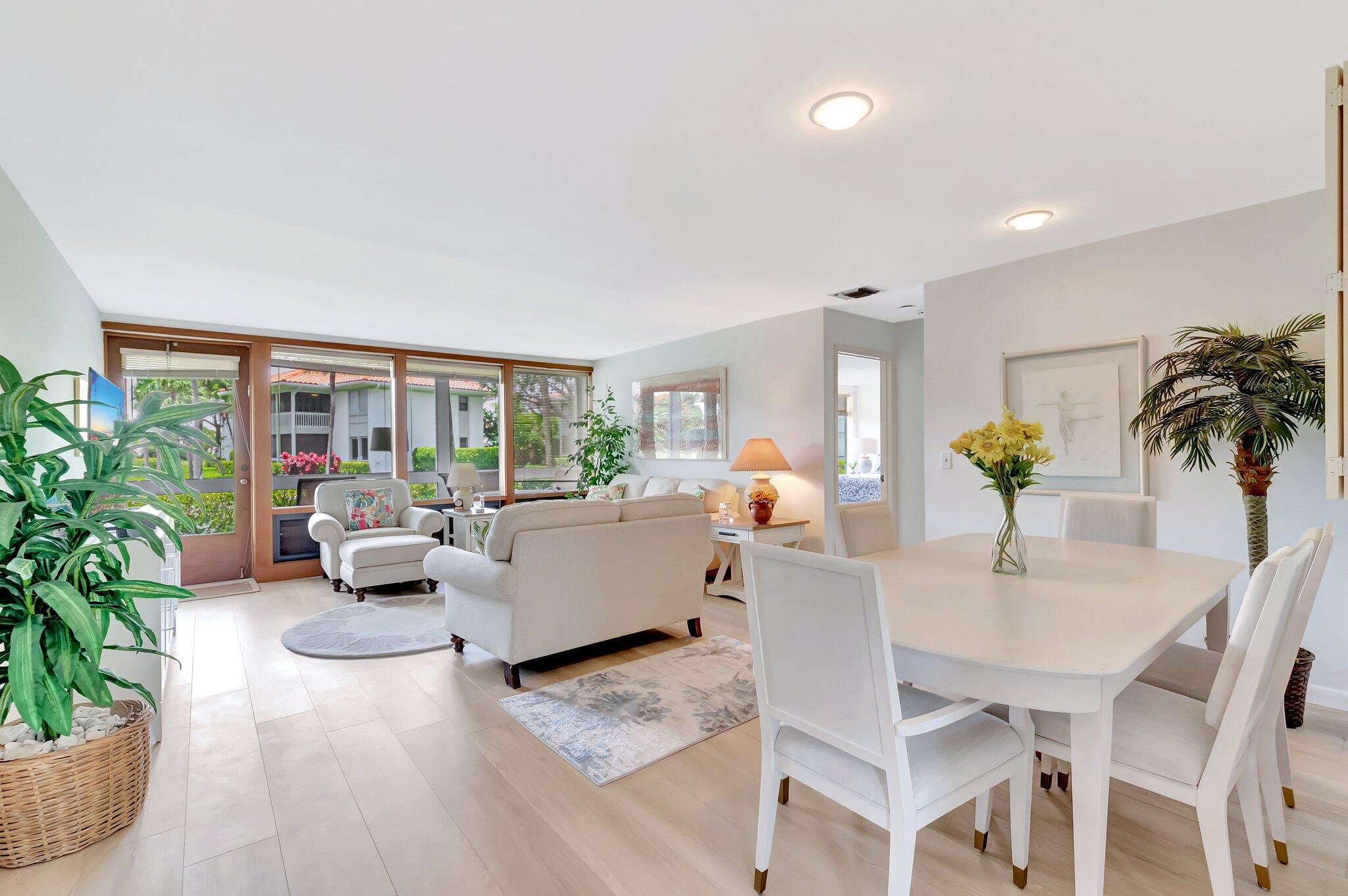 19819 Boca W Drive, Unit 4033 Boca Raton, FL 33434 - Photo 9 of 58 a living room with furniture and a potted plant