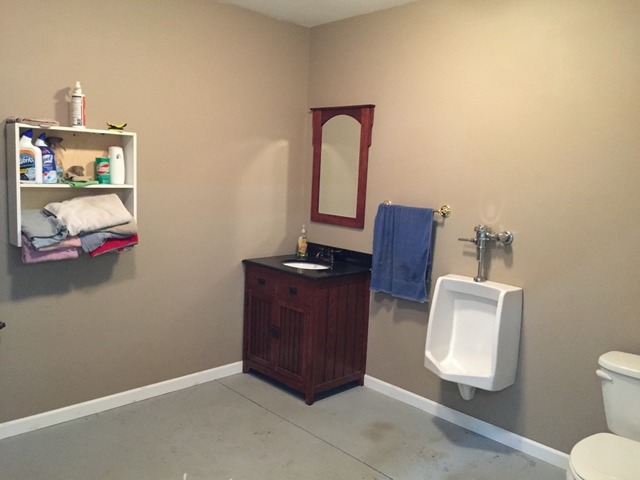 18102 Lincoln Road Morrison, IL 61270 - Photo 17 of 25 a room with a cabinet and a mirror