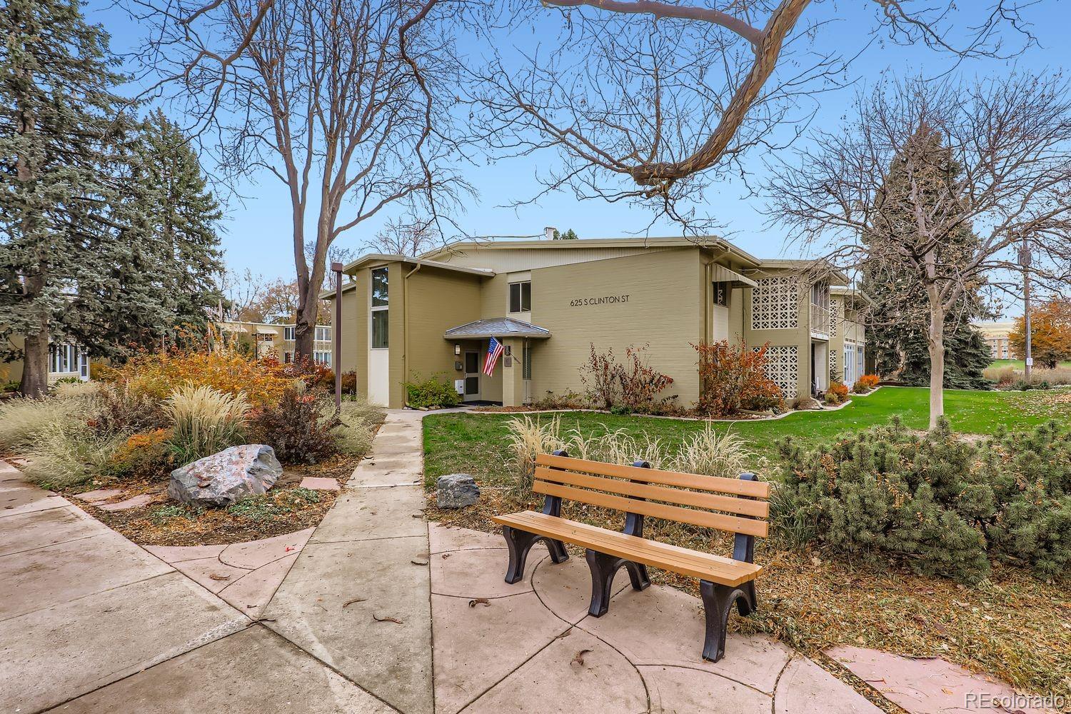625 South Clinton Street, Unit 7B Denver, CO 80247 - Photo 3 of 24 a view of a chairs and table in backyard of the house
