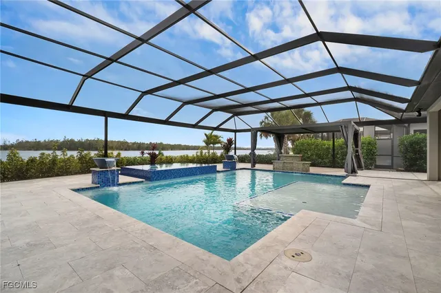a view of a swimming pool with a patio