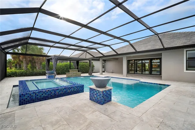 a patio area with table and chairs