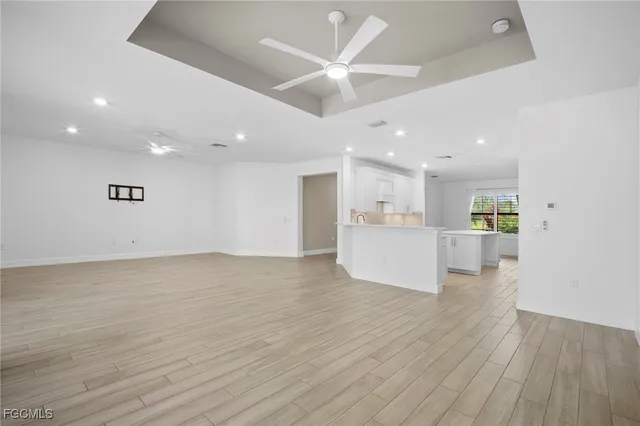 a view of kitchen with wooden floor and window
