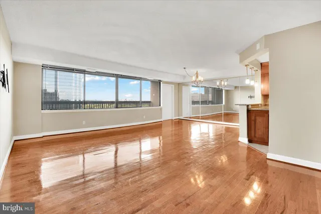 a view of a kitchen with wooden floor and a kitchen