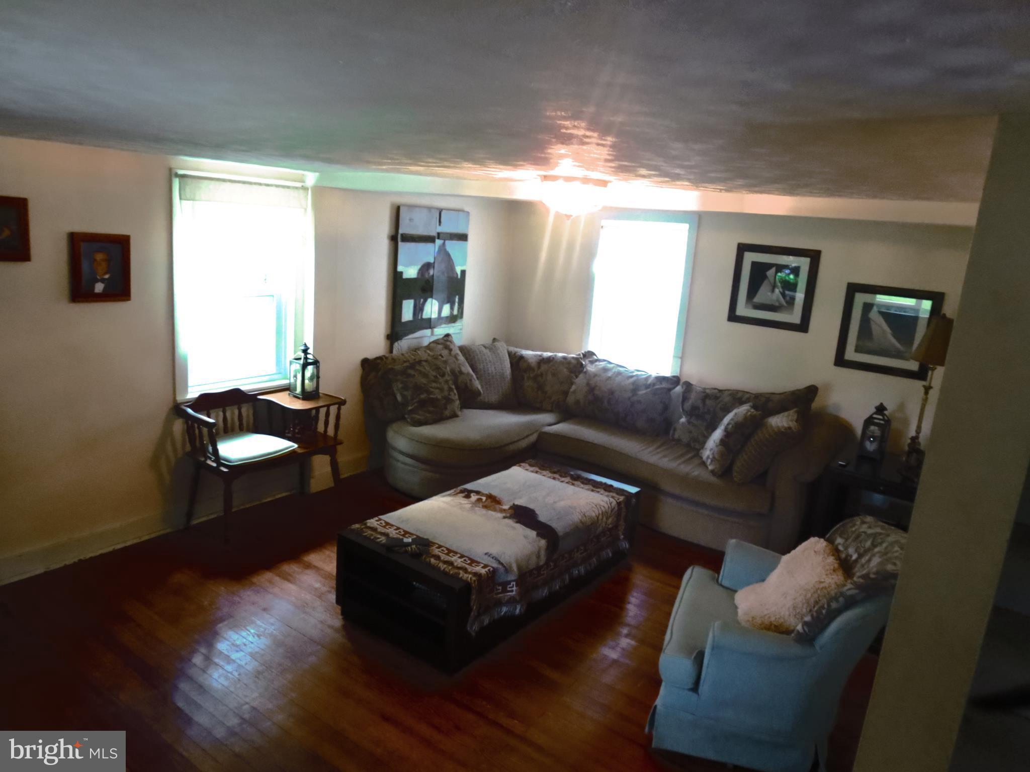 4166 Middleburg Road Union Bridge, MD 21791 - Photo 13 of 29 a living room with furniture and a wooden floor