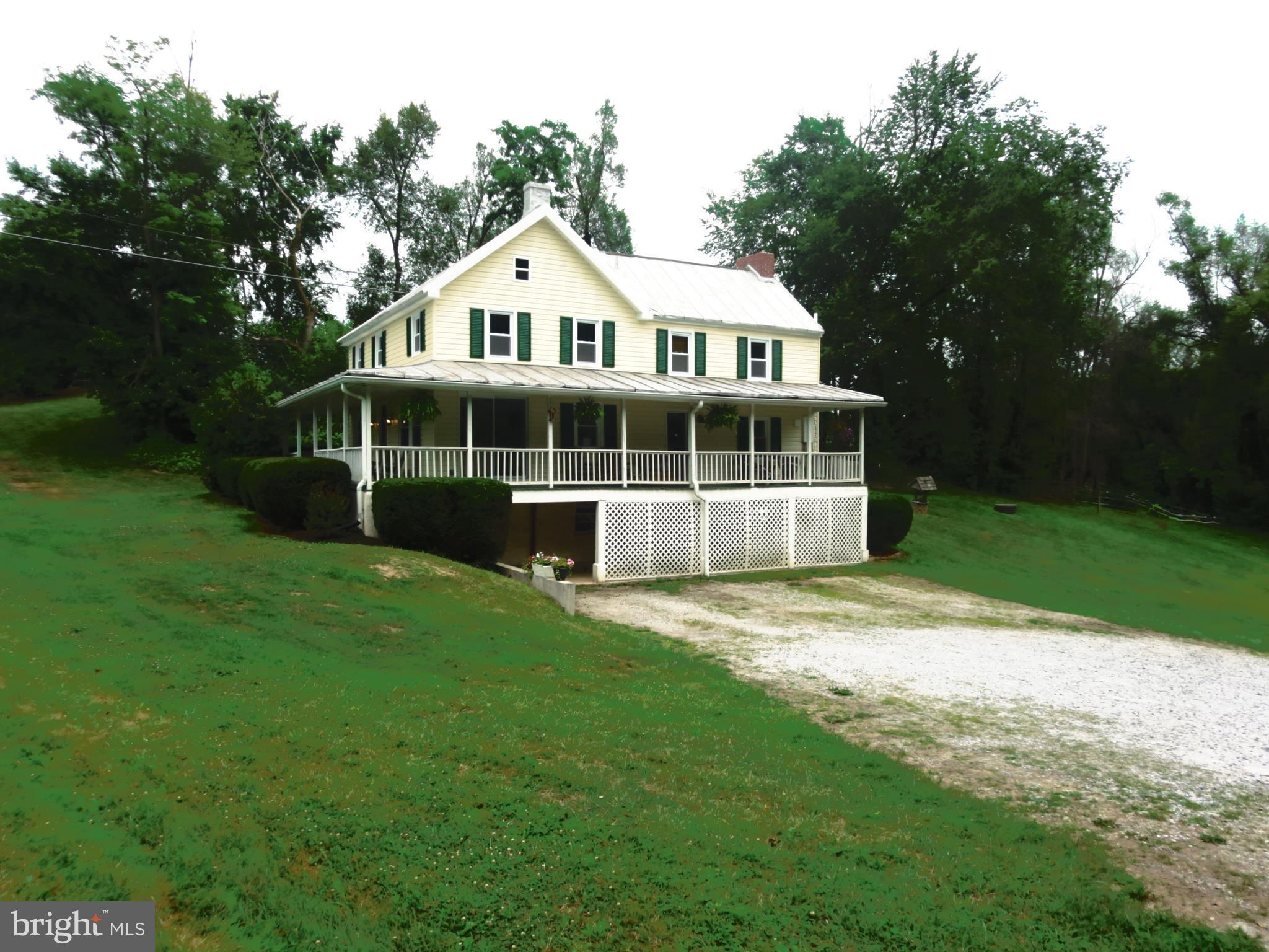 4166 Middleburg Road Union Bridge, MD 21791 - Photo 3 of 29 a front view of a house with a wooden deck and a yard