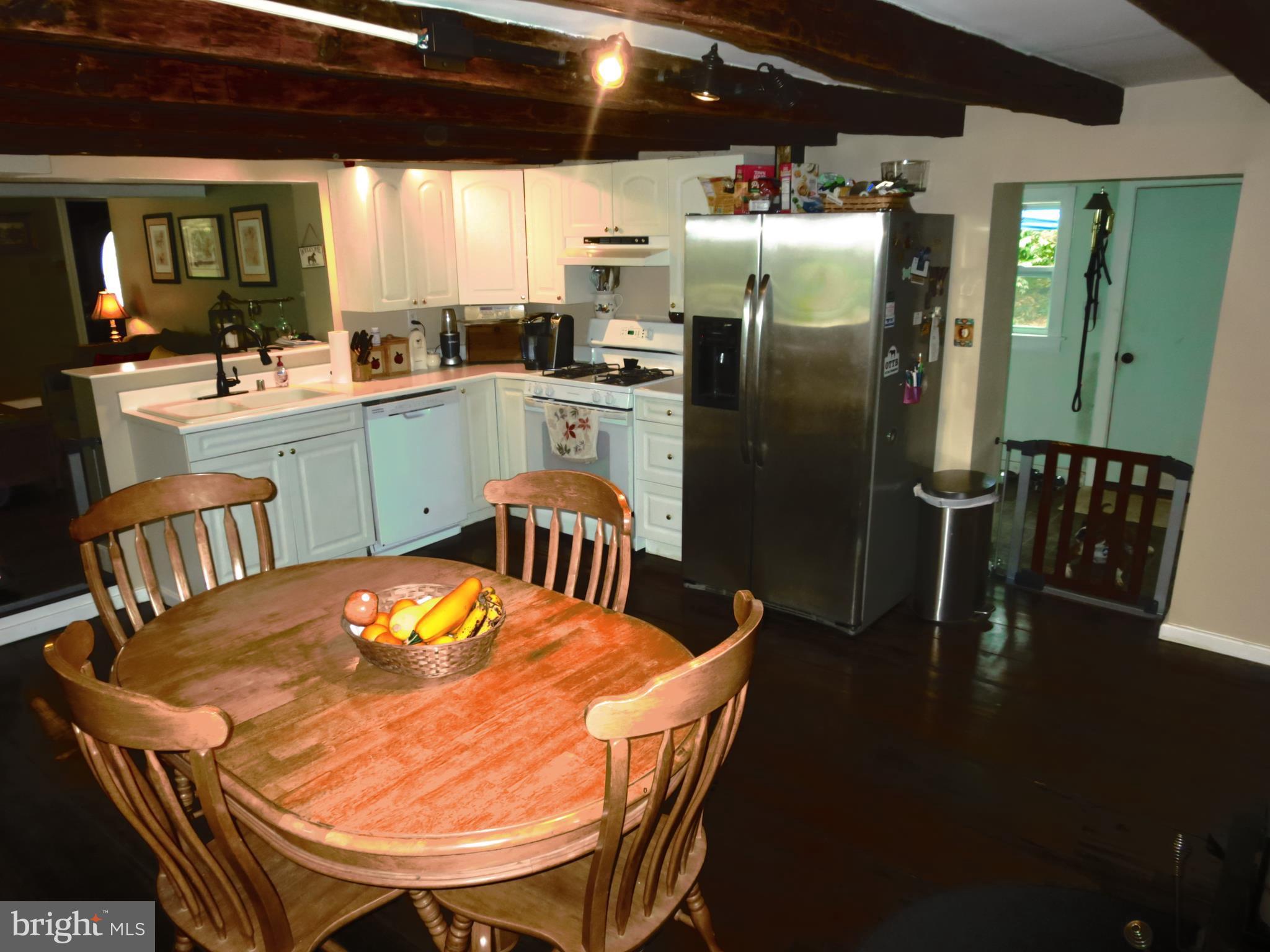 4166 Middleburg Road Union Bridge, MD 21791 - Photo 5 of 29 a dining table chairs and a kitchen view