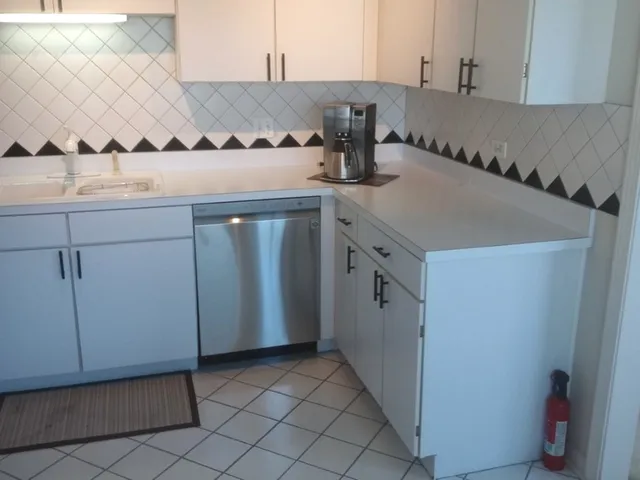 a kitchen with a sink and cabinets