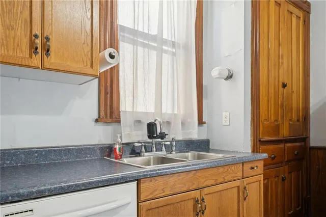 a kitchen with a sink and a window