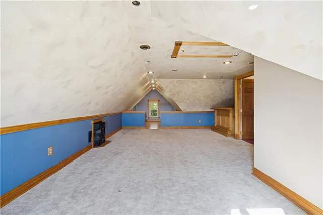 a view of a room with staircase and wooden floor