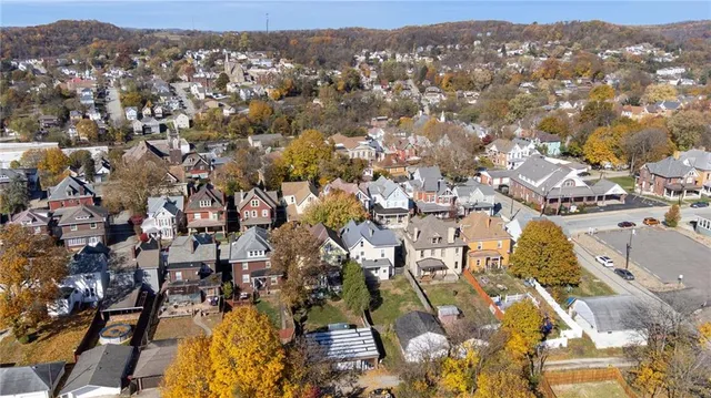an aerial view of residential houses with outdoor space