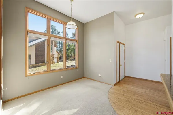 a view of a kitchen with furniture and a window