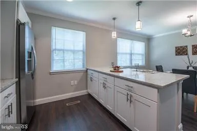 a bathroom with a sink double vanity granite tub and shower