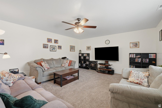 592 West 650 South Springville, UT 84663 - Photo 7 of 33 Spacious room featuring neutral wall tones, carpeted flooring, and a ceiling fan with integrated lighting