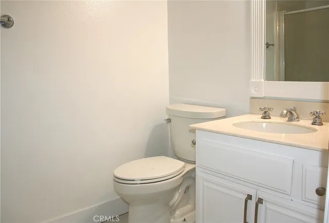 a bathroom with a glass shower door