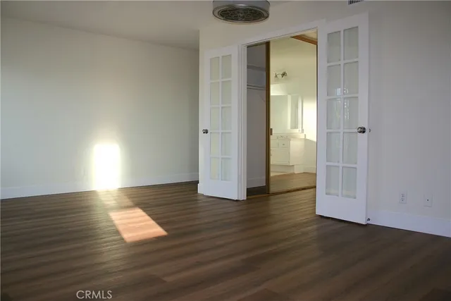 a bathroom with a granite countertop sink a large mirror a and window